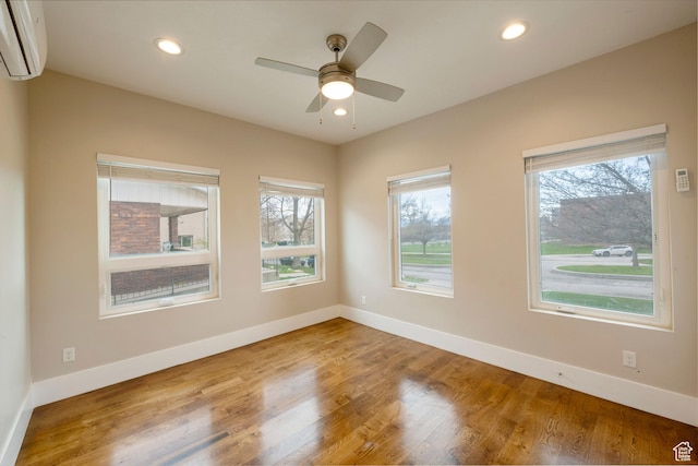 51 S 800 E, Salt Lake City, UT 84102 - unfurnished room with baseboards, a wall unit AC, and a healthy amount of sunlight