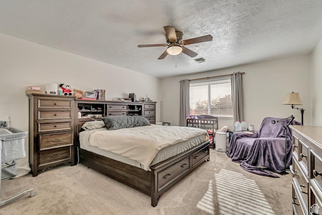 5518 S 875 E, South Ogden, UT 84405 - bedroom with light carpet, visible vents, a ceiling fan, and a textured ceiling