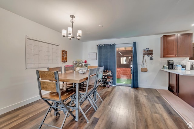 5518 S 875 E, South Ogden, UT 84405 - dining room with a notable chandelier, baseboards, and dark wood finished floors