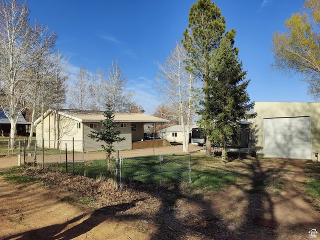 124 N Lakeview Dr, Manila, UT 84046 - view of yard featuring fence and a garage