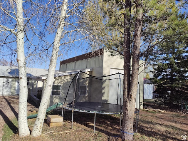 124 N Lakeview Dr, Manila, UT 84046 - back of house with a trampoline