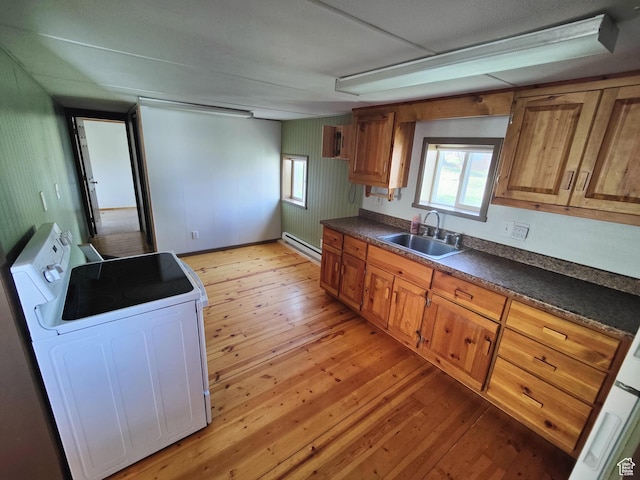 124 N Lakeview Dr, Manila, UT 84046 - kitchen with light wood-style floors, a sink, baseboard heating, and dark countertops