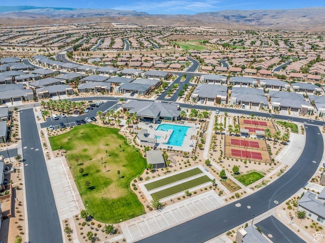 drone / aerial view featuring a residential view and a mountain view
