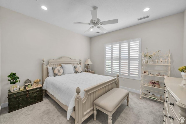 bedroom featuring recessed lighting, baseboards, ceiling fan, visible vents, and light carpet
