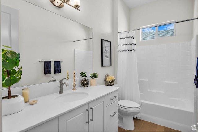 full bath featuring toilet, vanity, shower / bath combo with shower curtain, and wood finished floors