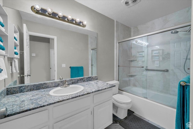 544 S Fiesta Dr, Ivins, UT 84738 - bathroom featuring toilet, vanity, bath / shower combo with glass door, and visible vents