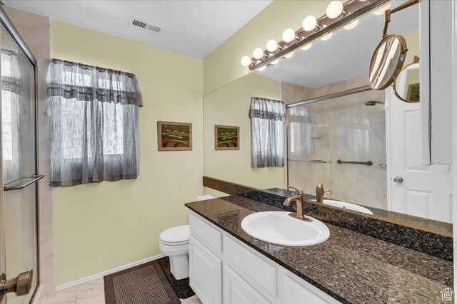 544 S Fiesta Dr, Ivins, UT 84738 - bathroom featuring vanity, toilet, baseboards, a shower stall, and visible vents