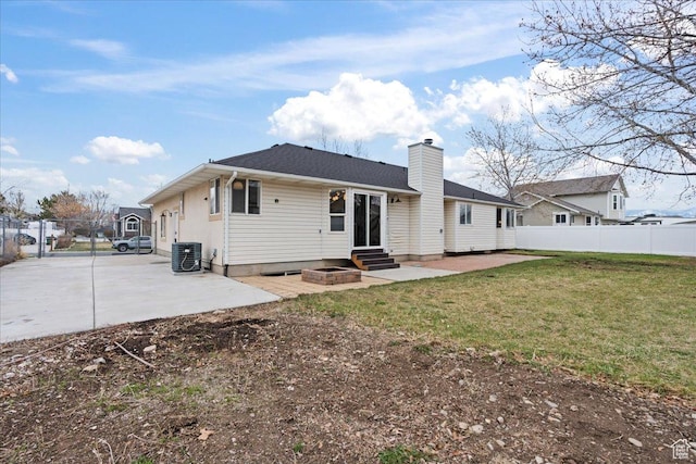 4489 W Black Elk Way, West Jordan, UT 84088 - rear view of house featuring fence, entry steps, and a patio area