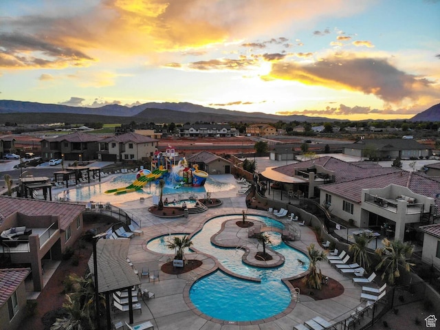 3823 W Dream Cir Unit 120, Santa Clara, UT 84765 - community pool featuring a residential view, a mountain view, and a patio