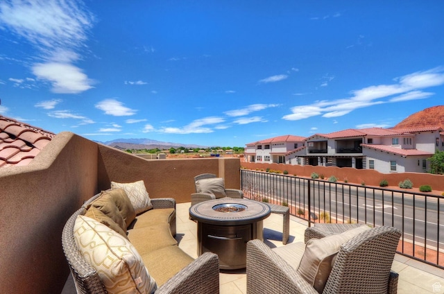 3823 W Dream Cir Unit 120, Santa Clara, UT 84765 - view of patio featuring a balcony, a residential view, and an outdoor living space with a fire pit