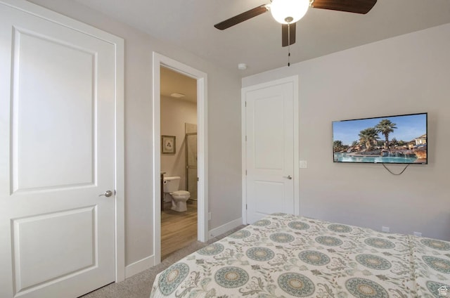 3823 W Dream Cir Unit 120, Santa Clara, UT 84765 - bedroom with light carpet, baseboards, connected bathroom, and a ceiling fan