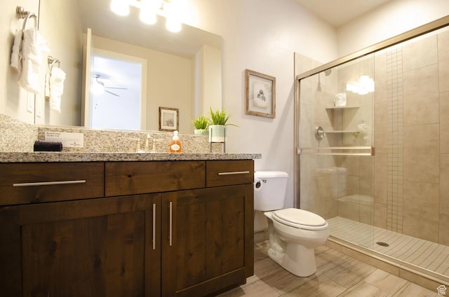 3823 W Dream Cir Unit 120, Santa Clara, UT 84765 - full bathroom featuring vanity, ceiling fan, toilet, and a shower stall