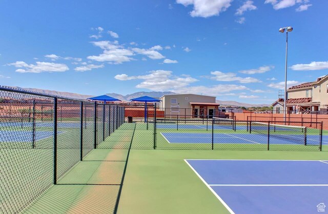 3823 W Dream Cir Unit 120, Santa Clara, UT 84765 - view of sport court featuring fence and a mountain view