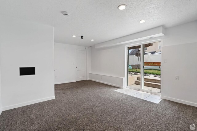 spare room with baseboards, carpet floors, recessed lighting, and a textured ceiling