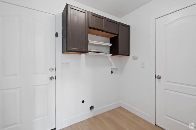 laundry room featuring hookup for an electric dryer, light wood-style flooring, baseboards, cabinet space, and hookup for a washing machine