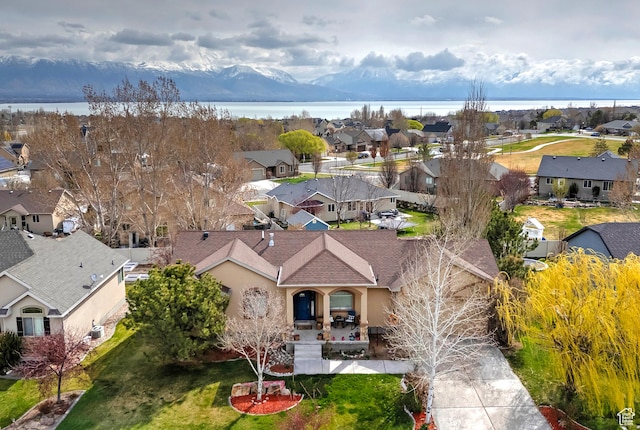 bird's eye view featuring a residential view and a water view