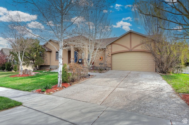 1288 S Pondside Dr, Saratoga Springs, UT 84045 - view of front of property featuring a front lawn, driveway, stucco siding, and an attached garage
