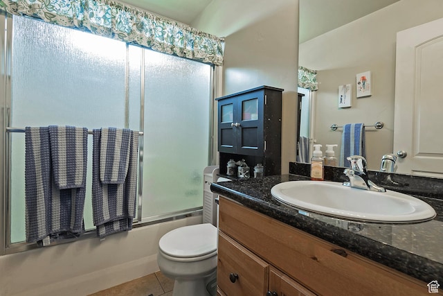 1288 S Pondside Dr, Saratoga Springs, UT 84045 - bathroom with tile patterned floors, shower / bath combination with glass door, toilet, and vanity