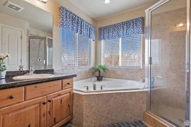 1288 S Pondside Dr, Saratoga Springs, UT 84045 - full bathroom with a shower stall, visible vents, vanity, and a garden tub