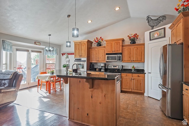 1288 S Pondside Dr, Saratoga Springs, UT 84045 - kitchen with a breakfast bar, appliances with stainless steel finishes, a center island with sink, decorative light fixtures, and recessed lighting