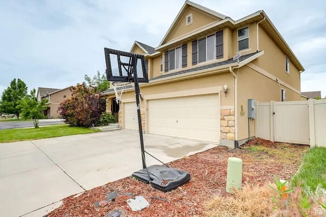 1784 W Grays Pl, Lehi, UT 84043 - view of front facade featuring driveway, a gate, stucco siding, fence, and an attached garage