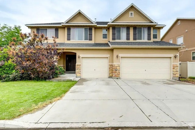 1784 W Grays Pl, Lehi, UT 84043 - view of front of home featuring a front yard, stone siding, concrete driveway, stucco siding, and an attached garage