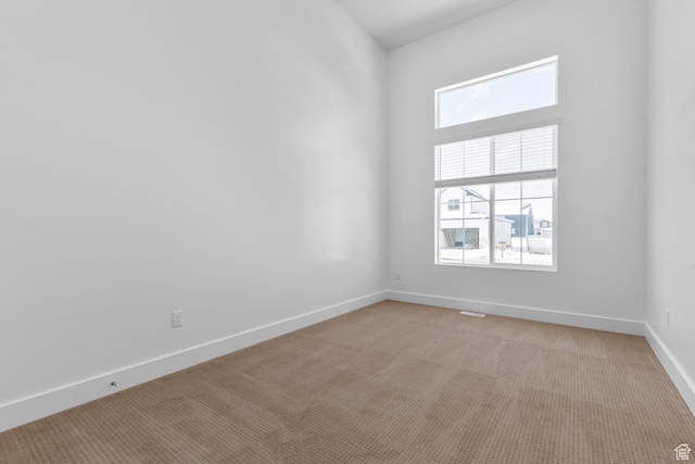2351 W 2950 N Unit 104, Farr West, UT 84404 - empty room with light carpet and baseboards