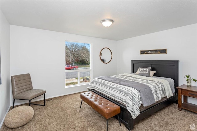 carpeted bedroom with baseboards
