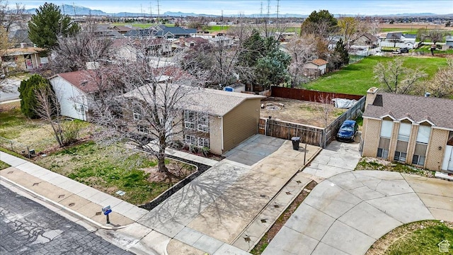 birds eye view of property with a residential view