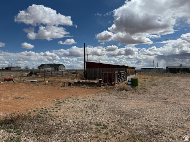 6051 N 11500 E, Lapoint, UT 84039 - view of yard with an outdoor structure, fence, and a pole building