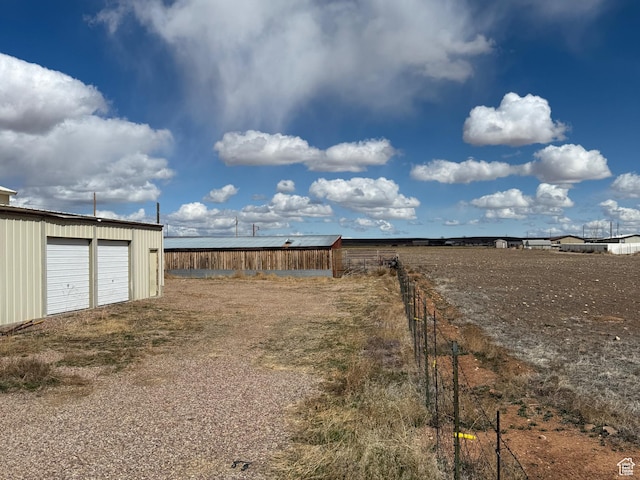 6051 N 11500 E, Lapoint, UT 84039 - view of yard featuring an outbuilding and a garage