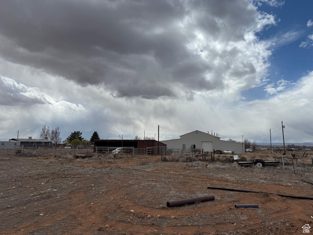 6051 N 11500 E, Lapoint, UT 84039 - view of yard featuring an outbuilding, fence, and a pole building