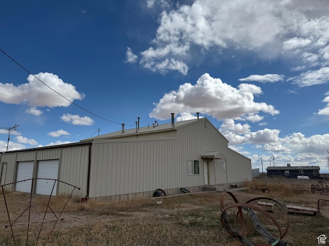6051 N 11500 E, Lapoint, UT 84039 - exterior space featuring a detached garage and an outbuilding