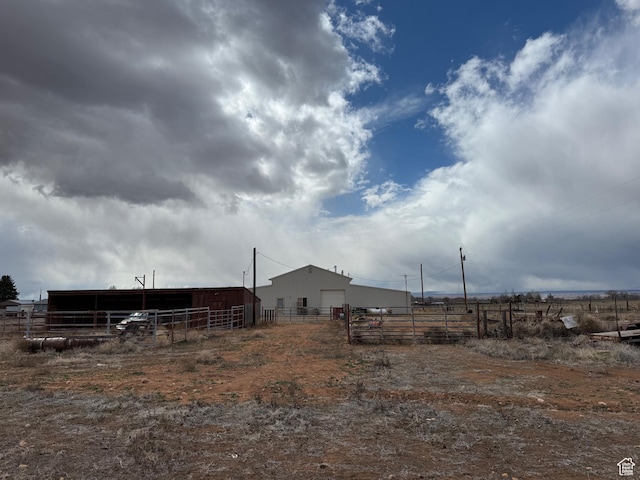 6051 N 11500 E, Lapoint, UT 84039 - view of yard with an outbuilding, fence, and a pole building