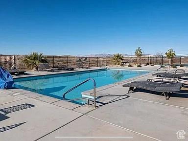 3150 Fuchsia Dr, St George, UT 84790 - community pool featuring a patio area and fence