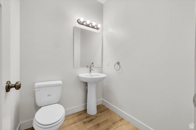 3150 Fuchsia Dr, St George, UT 84790 - bathroom with baseboards, toilet, and wood finished floors