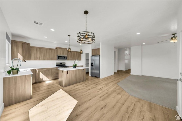 3150 Fuchsia Dr, St George, UT 84790 - kitchen with open floor plan, appliances with stainless steel finishes, a kitchen island, and recessed lighting