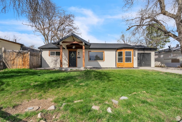 4970 S 4720 W, Salt Lake City, UT 84118 - view of front facade with driveway, a garage, fence, and a front yard