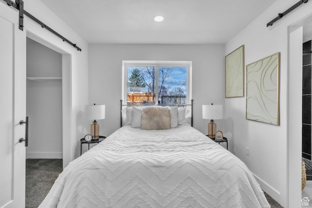 4970 S 4720 W, Salt Lake City, UT 84118 - carpeted bedroom featuring a spacious closet, a closet, baseboards, and a barn door
