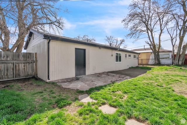 4970 S 4720 W, Salt Lake City, UT 84118 - rear view of property featuring fence, a lawn, and a patio area