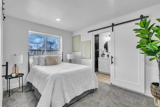 4970 S 4720 W, Salt Lake City, UT 84118 - bedroom with connected bathroom, a barn door, baseboards, light wood-style floors, and recessed lighting
