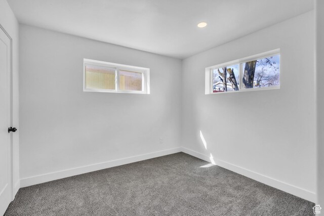4970 S 4720 W, Salt Lake City, UT 84118 - empty room featuring plenty of natural light, baseboards, and dark colored carpet