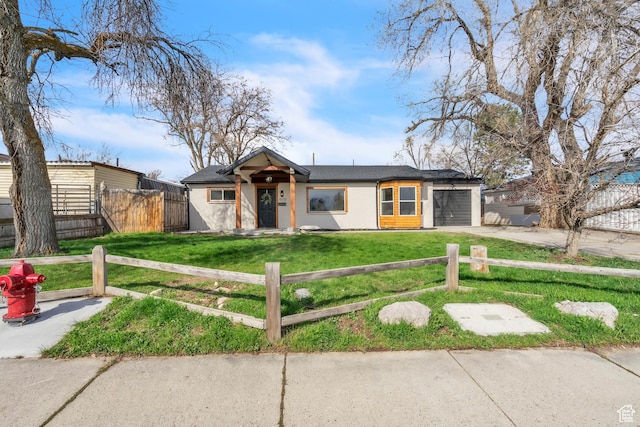 4970 S 4720 W, Salt Lake City, UT 84118 - mid-century home with a front yard, a fenced front yard, an attached garage, and driveway
