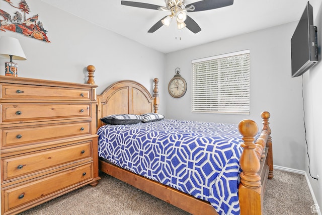 bedroom featuring baseboards, ceiling fan, and carpet flooring
