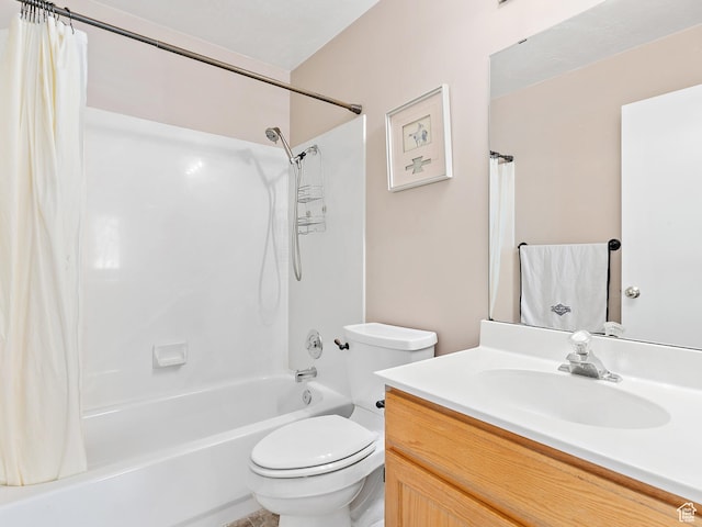 full bathroom featuring toilet, shower / bath combo with shower curtain, and vanity