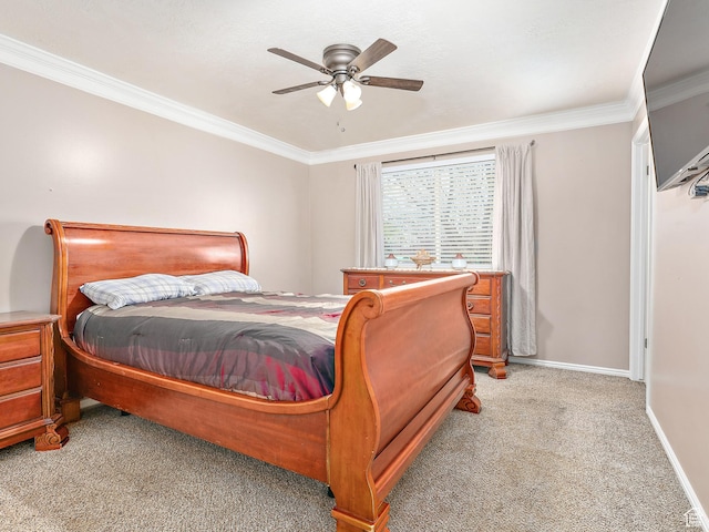bedroom featuring baseboards, a ceiling fan, crown molding, and light colored carpet