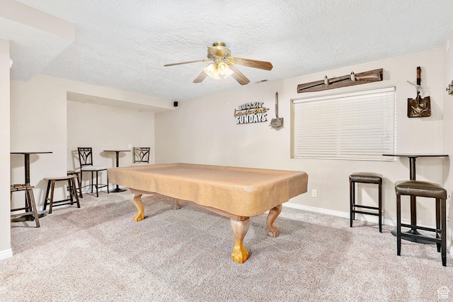rec room featuring carpet, baseboards, a textured ceiling, ceiling fan, and billiards