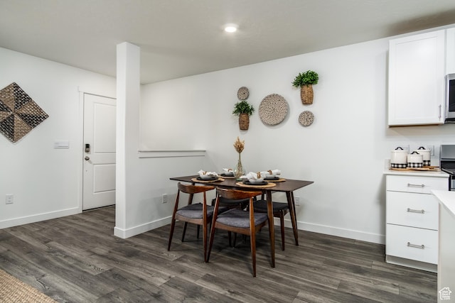 3440 W Mitchell Dr, Lehi, UT 84043 - dining area with dark wood-type flooring and baseboards