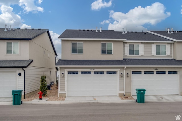 3440 W Mitchell Dr, Lehi, UT 84043 - view of front of house with central AC, a garage, and roof with shingles