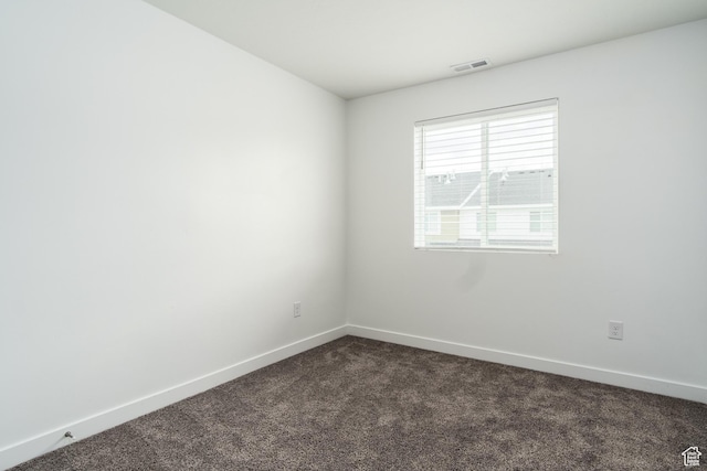 3440 W Mitchell Dr, Lehi, UT 84043 - unfurnished room with baseboards, visible vents, and dark colored carpet